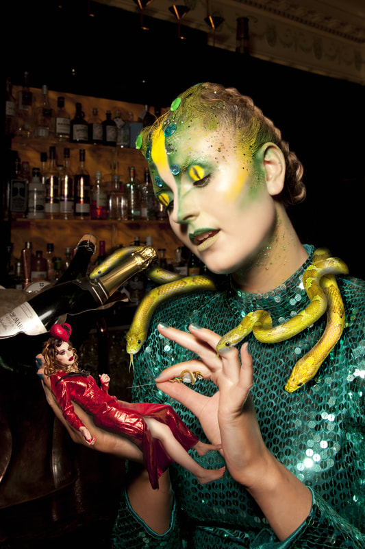 Composite photography by artist Debra Jayne, Georgina Markham as Envy in Green Snakes Sequin Dress Champagne