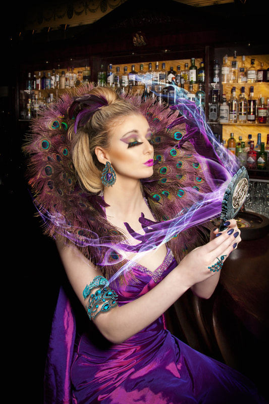 Composite photography by artist Debra Jayne, Alicia Wiley as Pride in Purple. Peacock Feathers, Magic Mirror, Evil Hands, Mirror Mirror