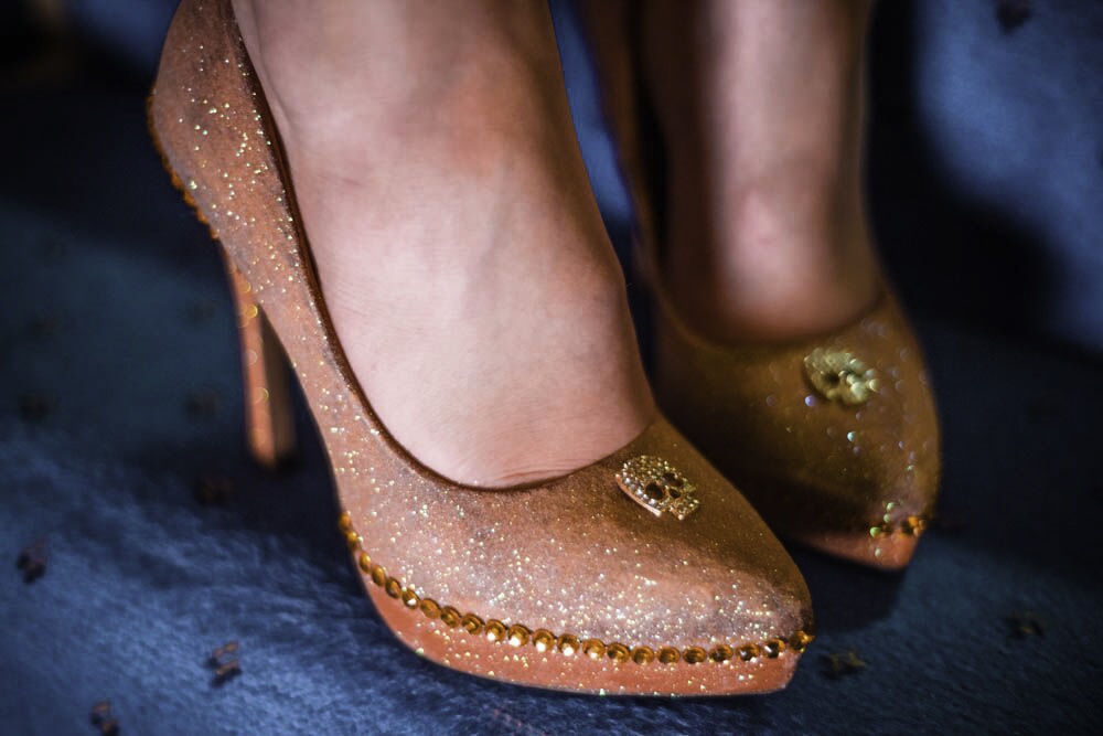 Orange glittered shoes with skulls and sequins, decorated by film director Debra Jayne